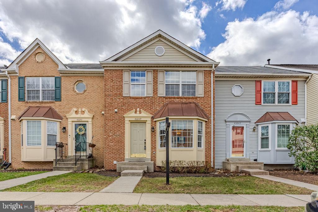 43249 Clearnight Terrace Ashburn, VA 20147 - Photo 1 of 39 a front view of a house with a yard
