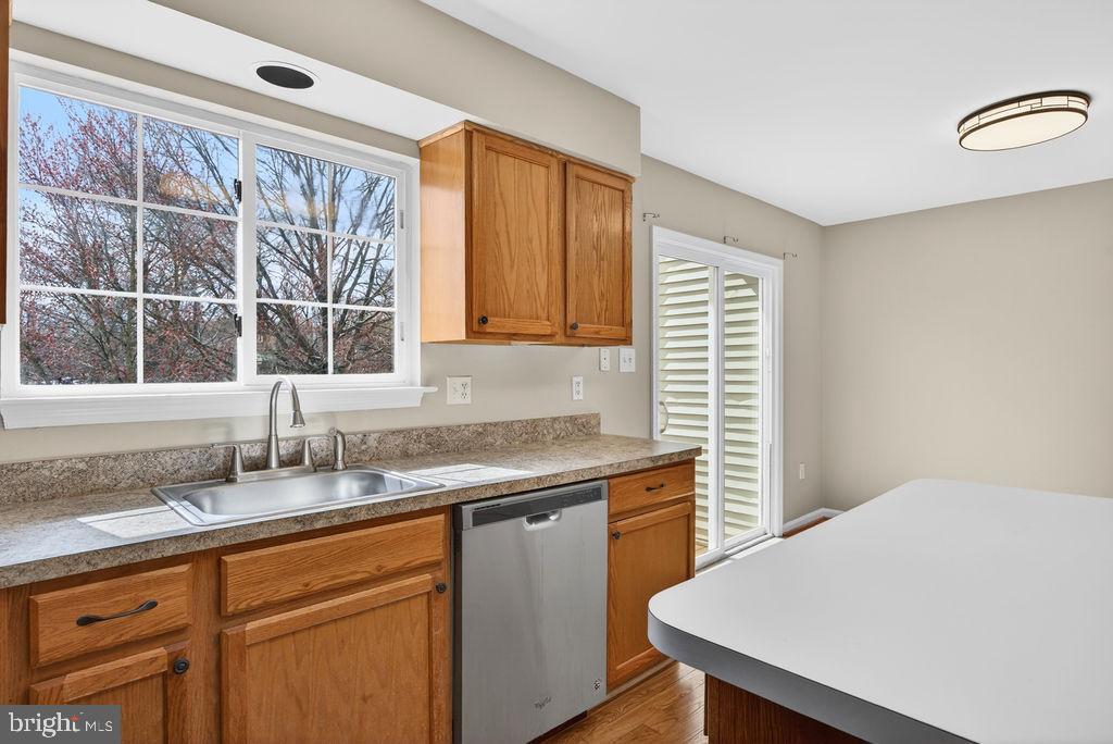 43249 Clearnight Terrace Ashburn, VA 20147 - Photo 15 of 39 a kitchen with a sink a window and cabinets