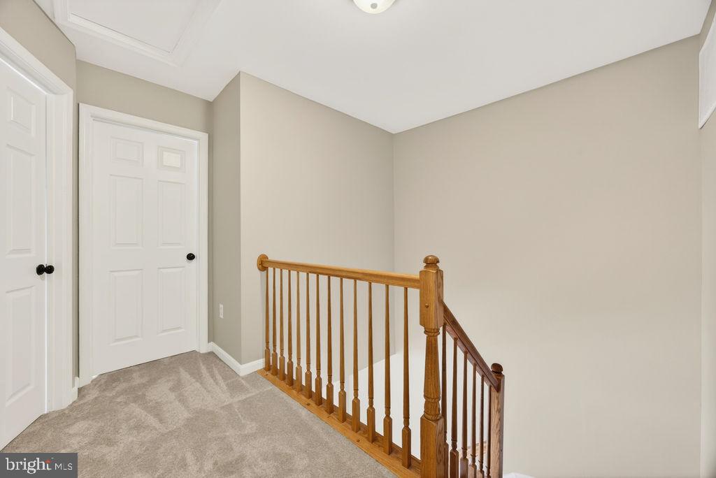 43249 Clearnight Terrace Ashburn, VA 20147 - Photo 21 of 39 a view of a hallway with wooden floor and entryway