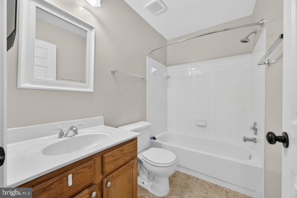 43249 Clearnight Terrace Ashburn, VA 20147 - Photo 31 of 39 a bathroom with a sink toilet and shower