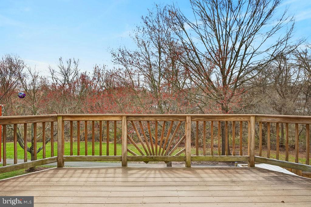 43249 Clearnight Terrace Ashburn, VA 20147 - Photo 6 of 39 a view of balcony with wooden floor and fence