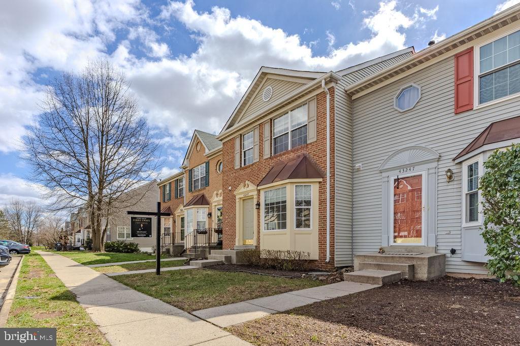 43249 Clearnight Terrace Ashburn, VA 20147 - Photo 10 of 39 a view of a white house next to a yard