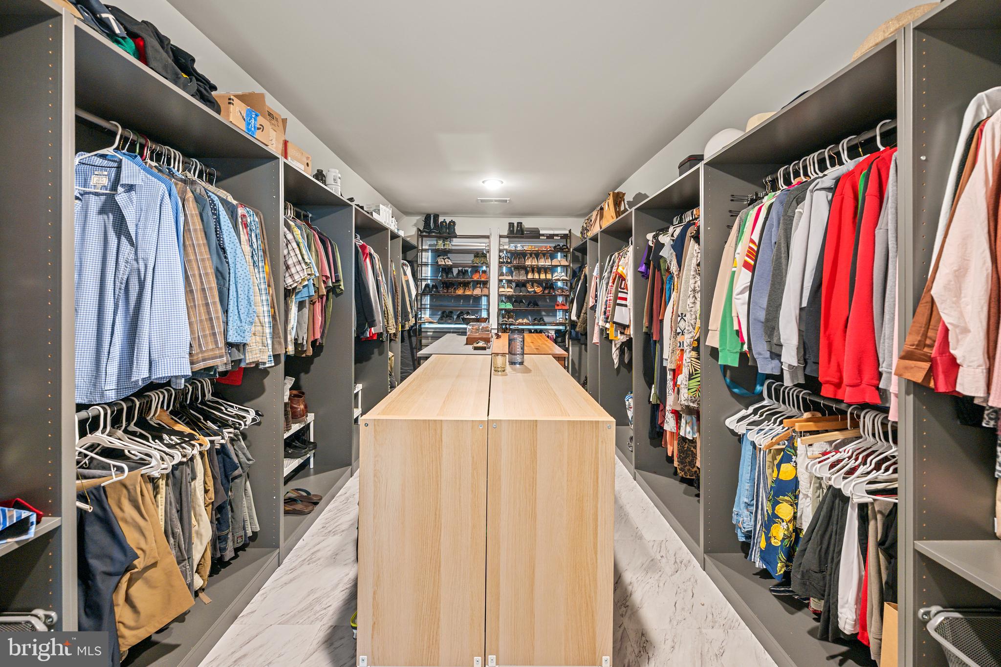 8459 Reformatory Way Lorton, VA 22079 - Photo 34 of 78 a view of walk in closet with clothes