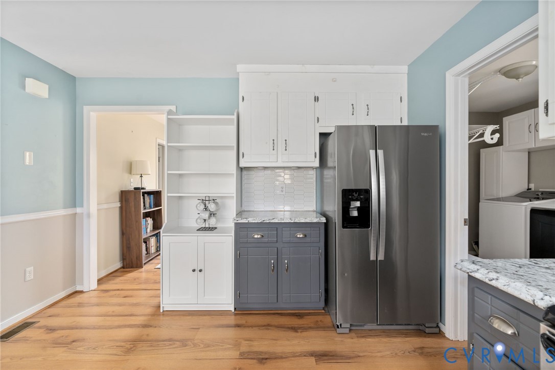 13642 Decidedly Court Midlothian, VA 23112 - Photo 12 of 35 a kitchen with stainless steel appliances granite countertop a refrigerator and a sink