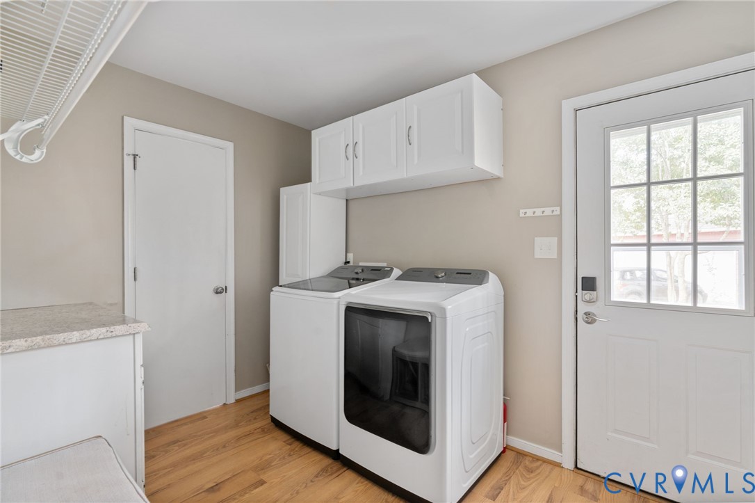 13642 Decidedly Court Midlothian, VA 23112 - Photo 14 of 35 a utility room with wooden floor washer and dryer