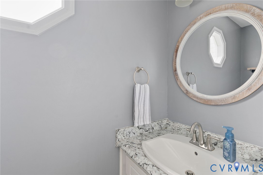 13642 Decidedly Court Midlothian, VA 23112 - Photo 16 of 35 a bathroom with a sink and a mirror