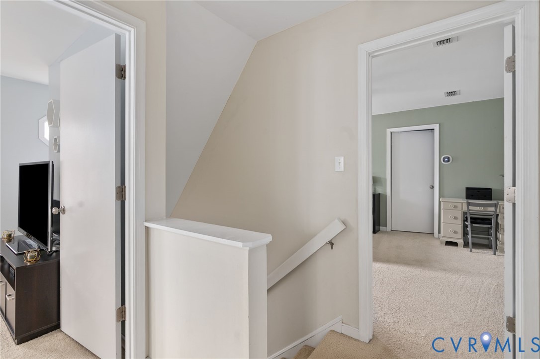 13642 Decidedly Court Midlothian, VA 23112 - Photo 19 of 35 a view of a hallway with wooden floor and closet