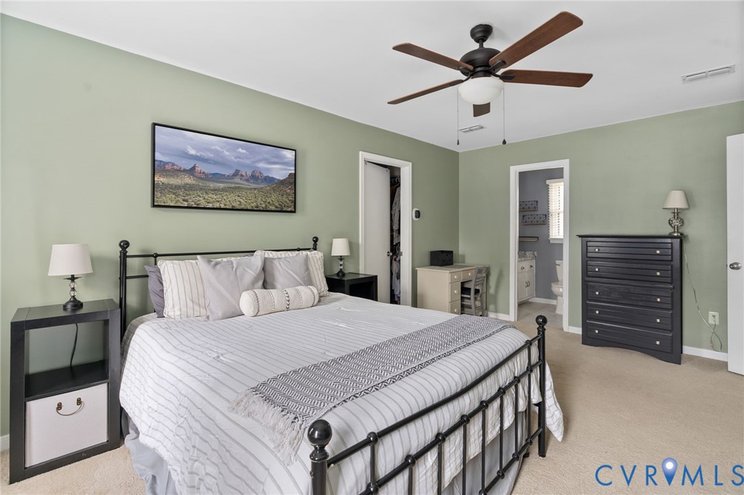 13642 Decidedly Court Midlothian, VA 23112 - Photo 22 of 35 a bedroom with a bed and a chandelier