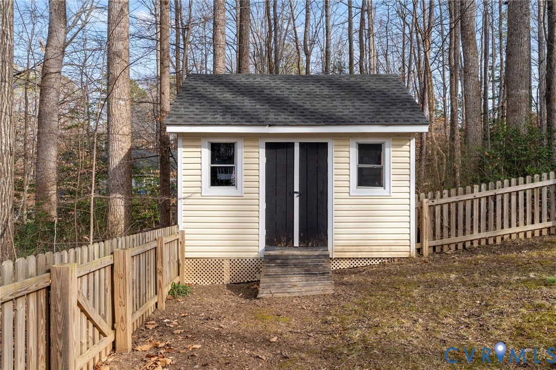 13642 Decidedly Court Midlothian, VA 23112 - Photo 34 of 35 a view of a house with a small yard and wooden fence