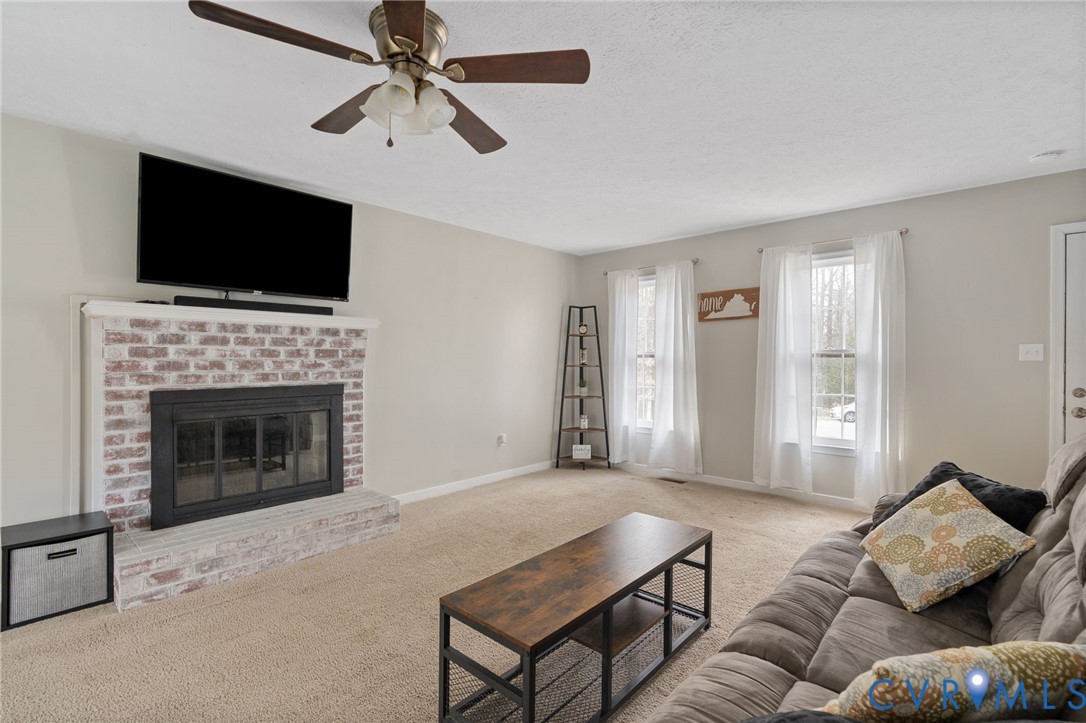 13642 Decidedly Court Midlothian, VA 23112 - Photo 5 of 35 a living room with furniture fireplace and flat screen tv