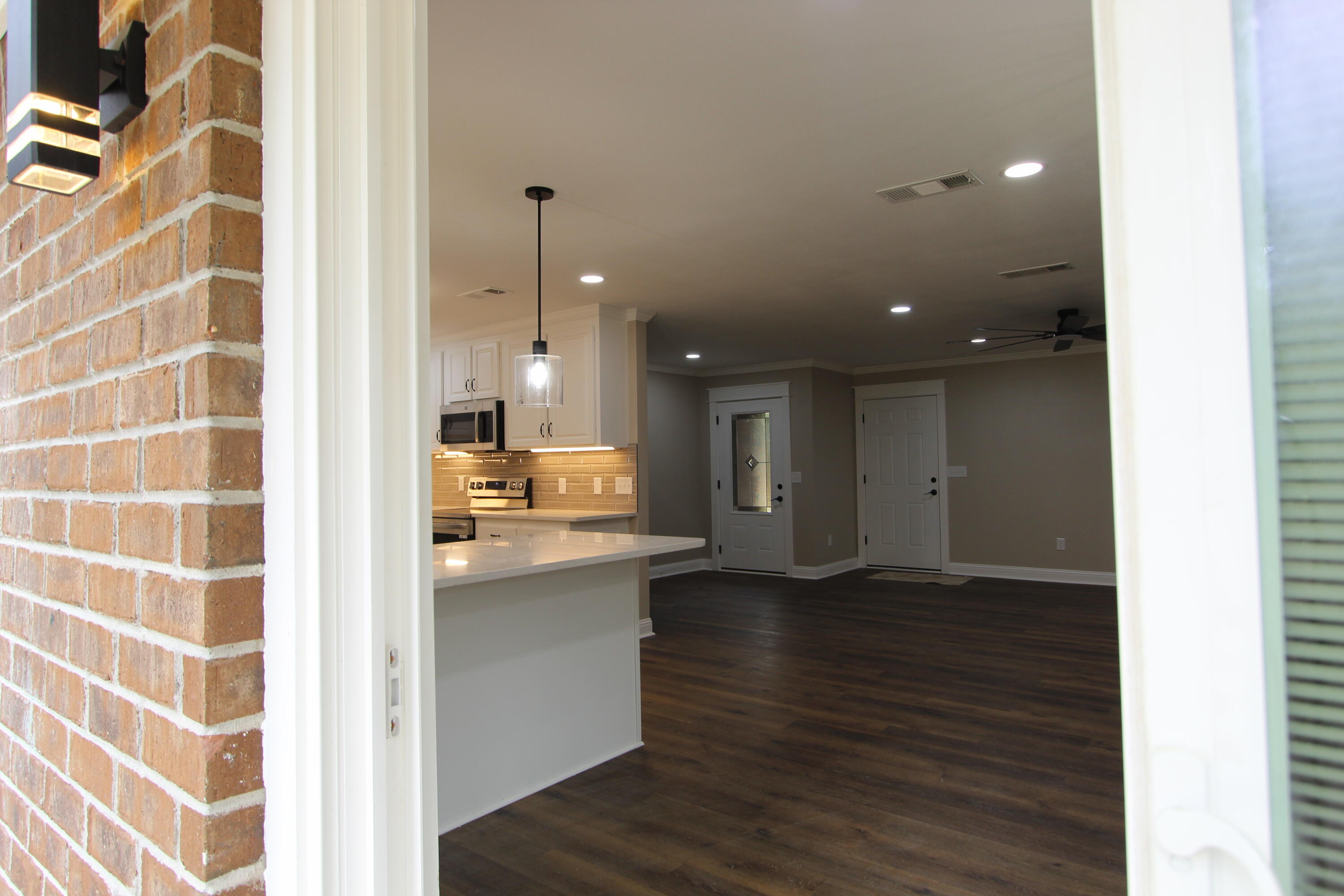 4052 Randi Road Crestview, FL 32539 - Photo 26 of 27 a view of a kitchen from the hallway