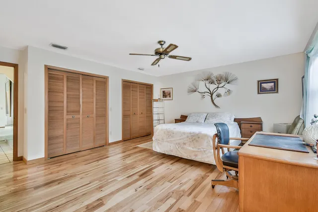 a bedroom with bed and window