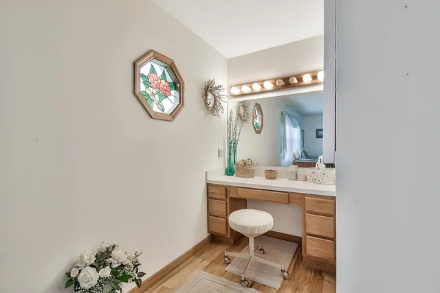a view of a bathroom with a sink and a mirror