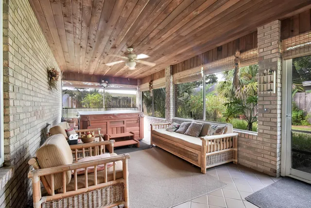 a living room with couch a table and chairs