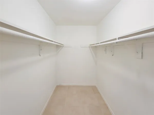 a view of a livingroom with a ceiling fan and window