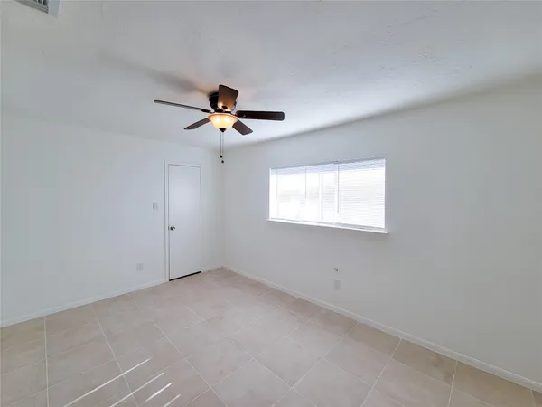 a bathroom with a granite countertop double vanity sink and mirror with bathtub