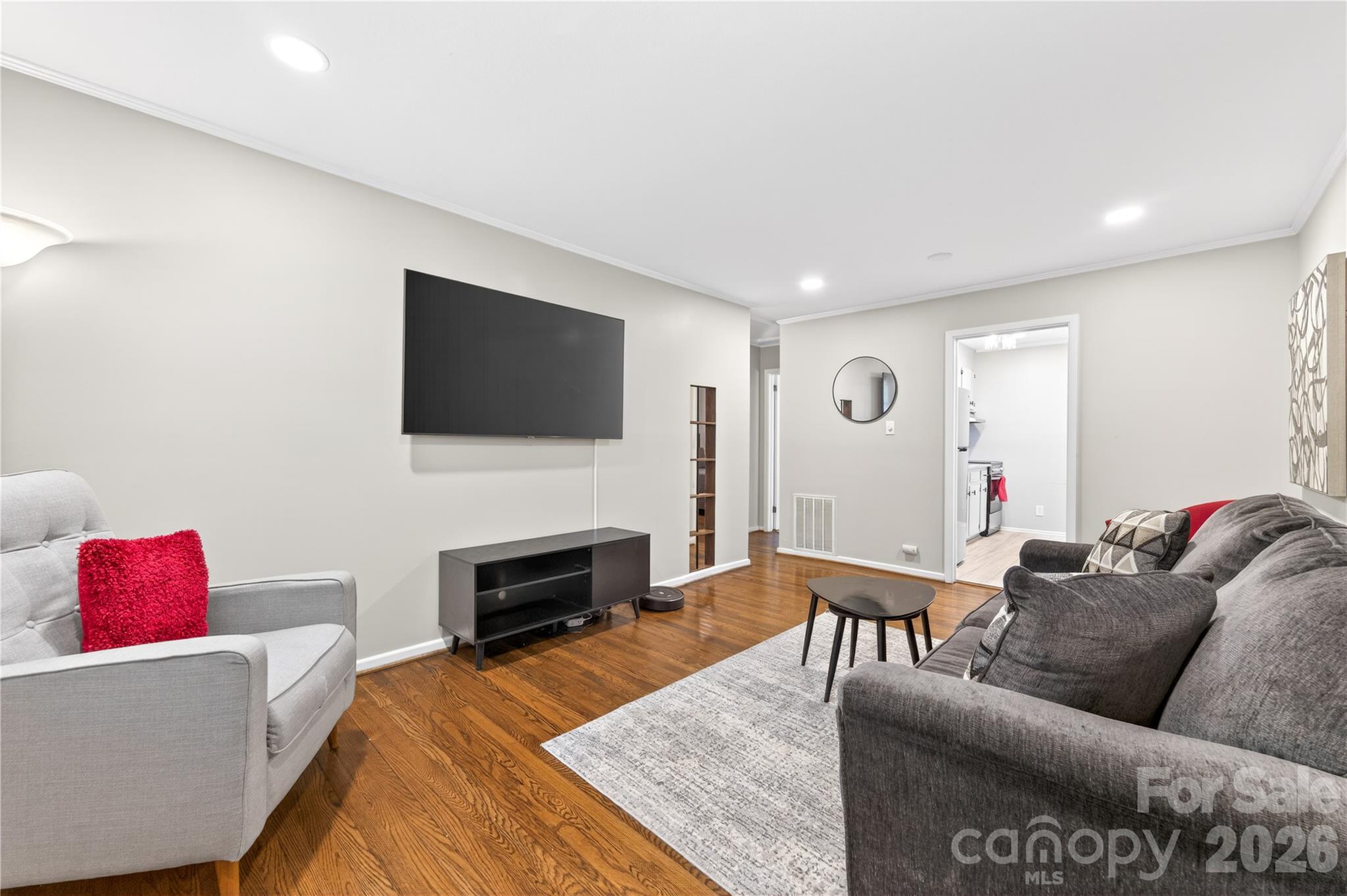 3241 Minnesota Road Charlotte, NC 28208 - Photo 5 of 18 a living room with furniture and a flat screen tv