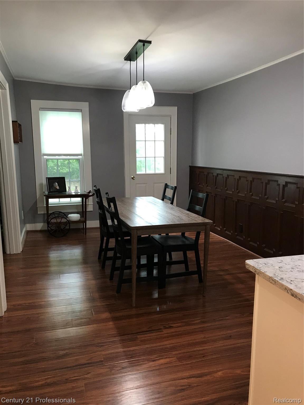 7222 Tucker Road Holly, MI 48442 - Photo 11 of 36 Dining Room with New Floors and Detailed Wood Wainscoting....
