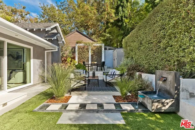 a view of yard with patio