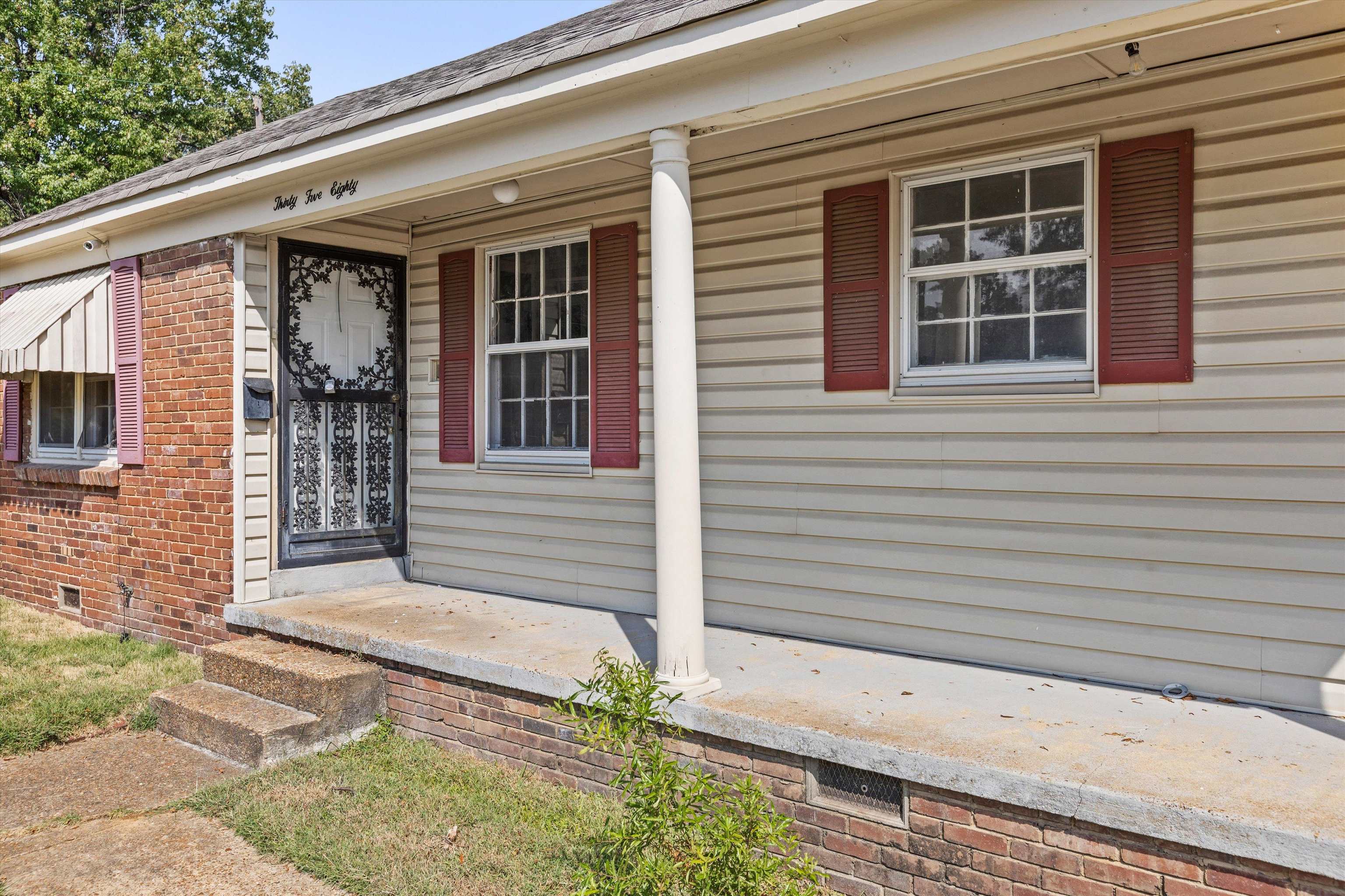 3580 Rhodes Avenue Memphis, TN 38111 - Photo 3 of 26 a front view of a house with a yard