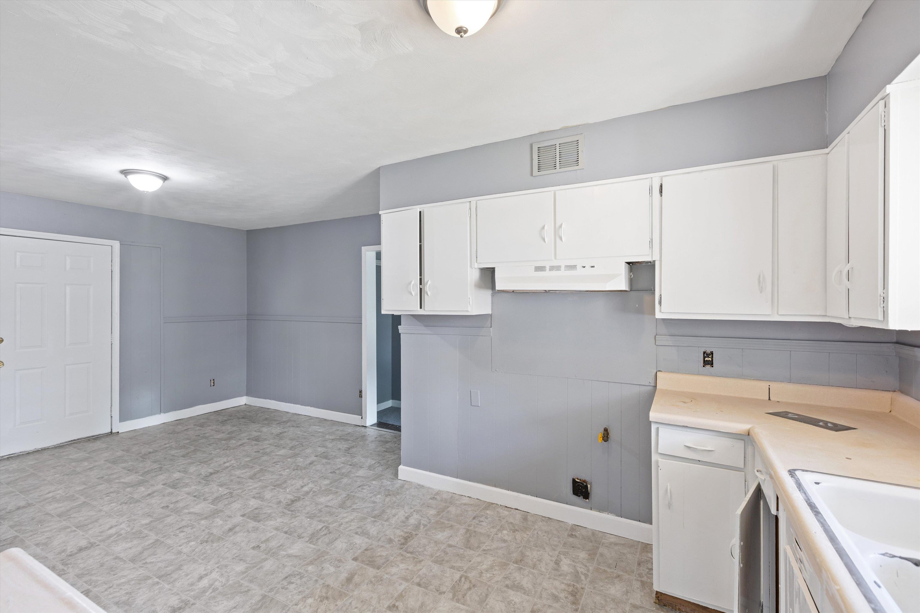 3580 Rhodes Avenue Memphis, TN 38111 - Photo 10 of 26 a view of kitchen with white cabinets and white appliances