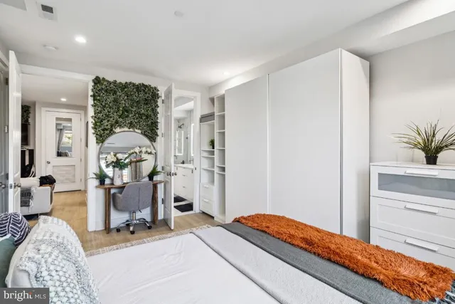 a bed room with a bed and a window