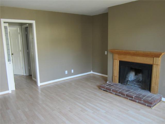 945 General George Patton Road, Unit 945 Nashville, TN 37221 - Photo 5 of 11 Den w/laminate flooring & brick fireplace |