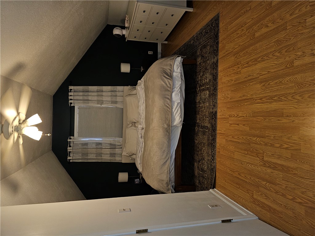2105 Shroyer Road Dayton, OH 45419 - Photo 22 of 35 This cozy bedroom features warm wooden flooring and abundant natural light for comfortable living.