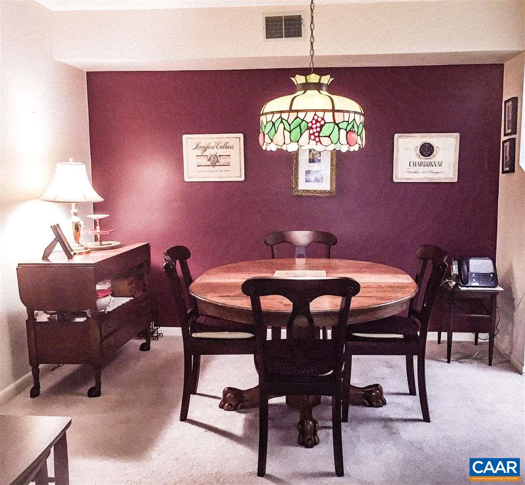 125 Turtle Creek Road, Unit 3 Charlottesville, VA 22901 - Photo 12 of 14 a view of a dining room with furniture and chandelier