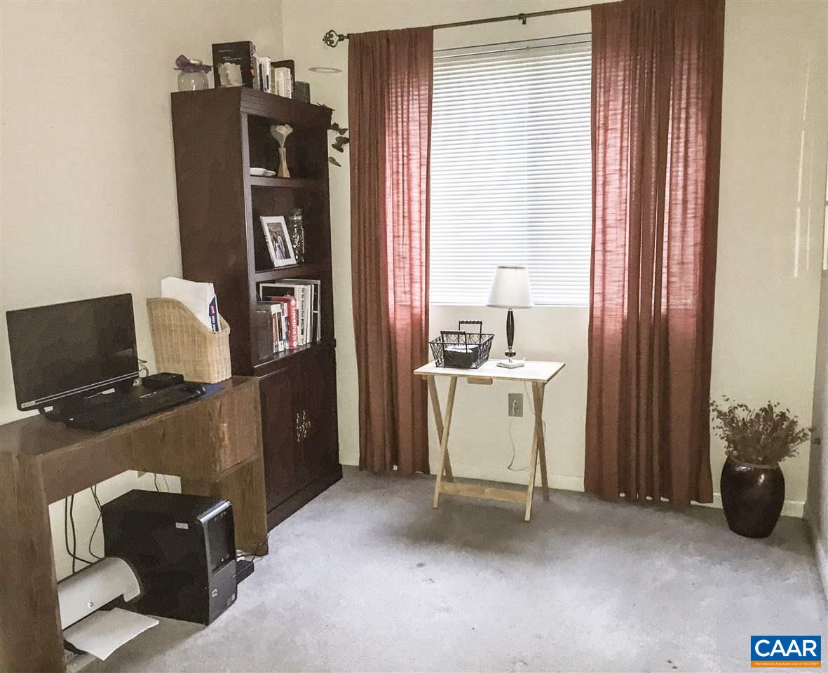 125 Turtle Creek Road, Unit 3 Charlottesville, VA 22901 - Photo 13 of 14 a room with furniture a rug and a window