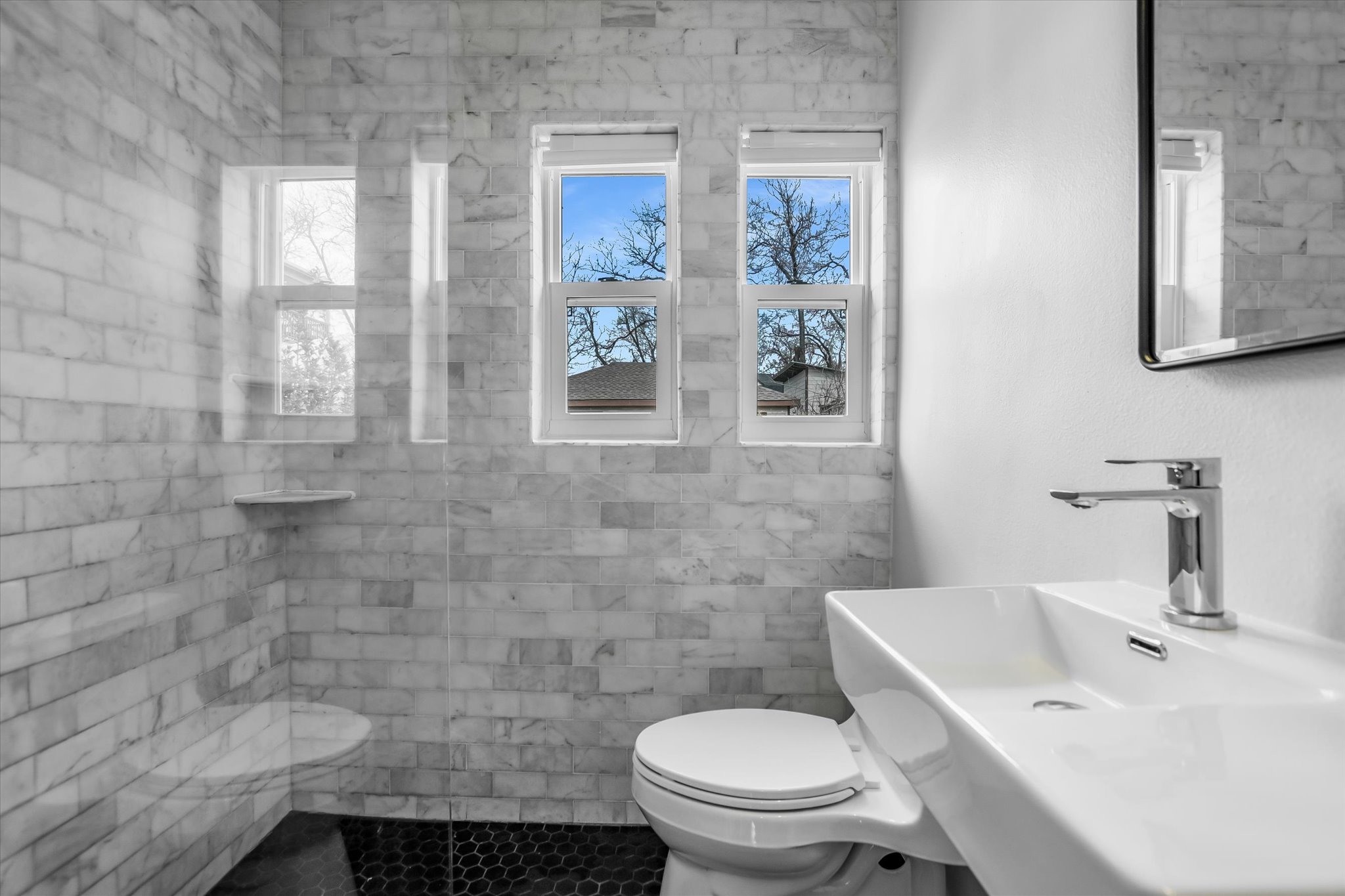 604 East 46th Street Austin, TX 78751 - Photo 13 of 16 a bathroom with a sink a toilet and a mirror