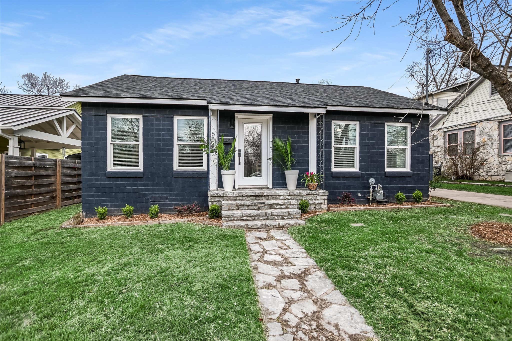 604 East 46th Street Austin, TX 78751 - Photo 2 of 16 a front view of a house with a yard table and chairs