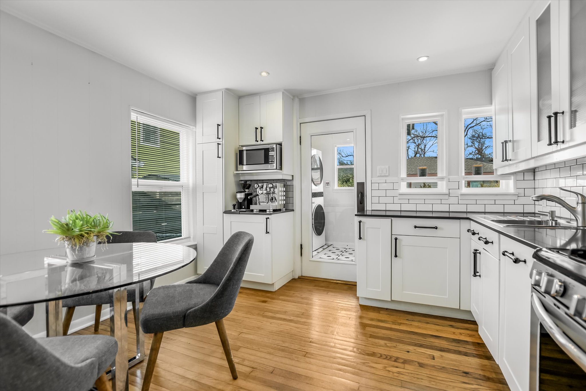 604 East 46th Street Austin, TX 78751 - Photo 10 of 16 a kitchen with stainless steel appliances granite countertop a kitchen island hardwood floor and a sink