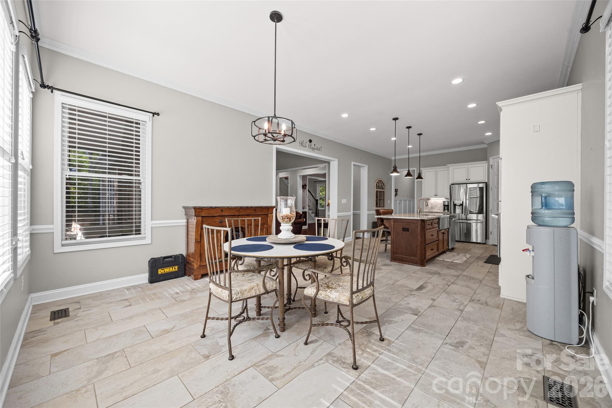 790 Brandon Road Clover, SC 29710 - Photo 23 of 43 a view of a dining room and livingroom with furniture wooden floor a chandelier