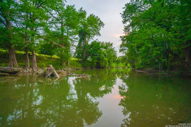 a living room with furniture fireplace and flat screen tv