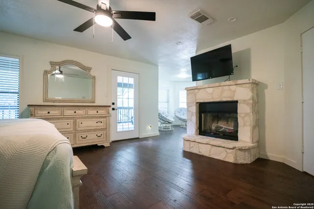 a view of a house with a yard and tree s