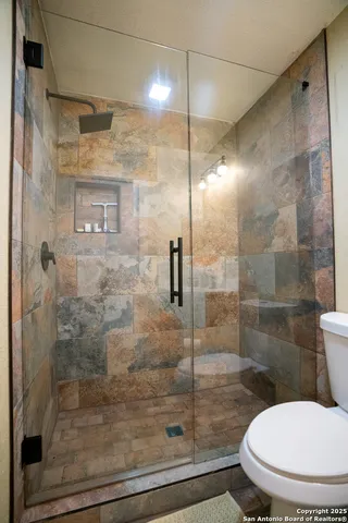 a backyard of a house with lots of trees