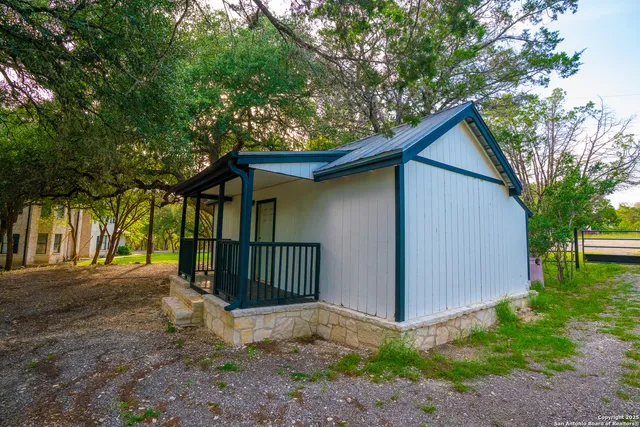 a view of a backyard of the house