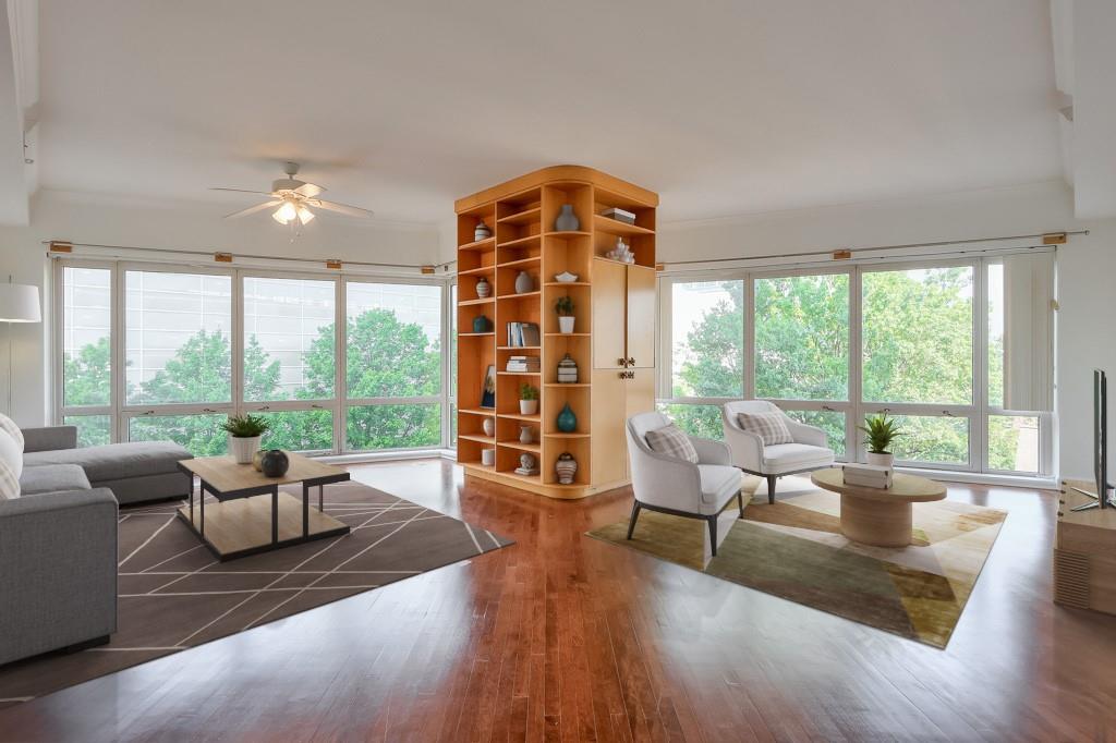 3475 Oak Valley Road Northeast, Unit 530 Atlanta, GA 30326 - Photo 15 of 37 a living room with furniture and a large window with outer view
