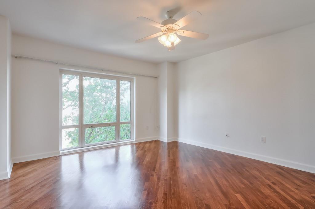 3475 Oak Valley Road Northeast, Unit 530 Atlanta, GA 30326 - Photo 20 of 37 a view of a room with wooden floor and a window