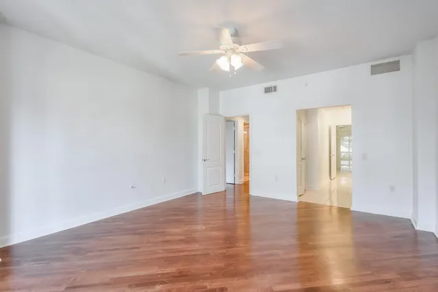 a bathroom with a shower sink and a mirror