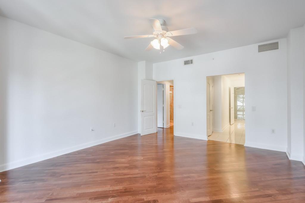 3475 Oak Valley Road Northeast, Unit 530 Atlanta, GA 30326 - Photo 21 of 37 a view of an empty room with wooden floor