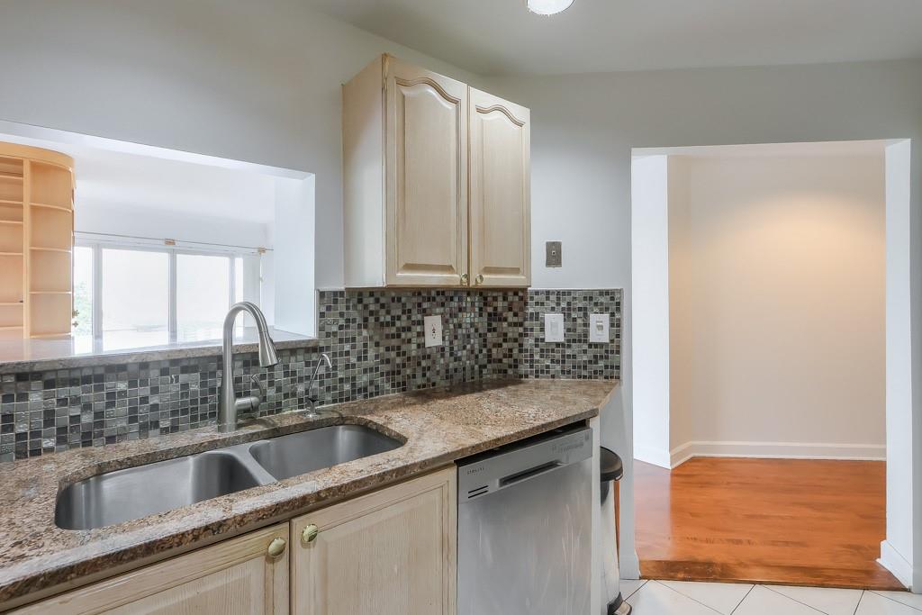 3475 Oak Valley Road Northeast, Unit 530 Atlanta, GA 30326 - Photo 29 of 37 a kitchen with a sink and cabinets