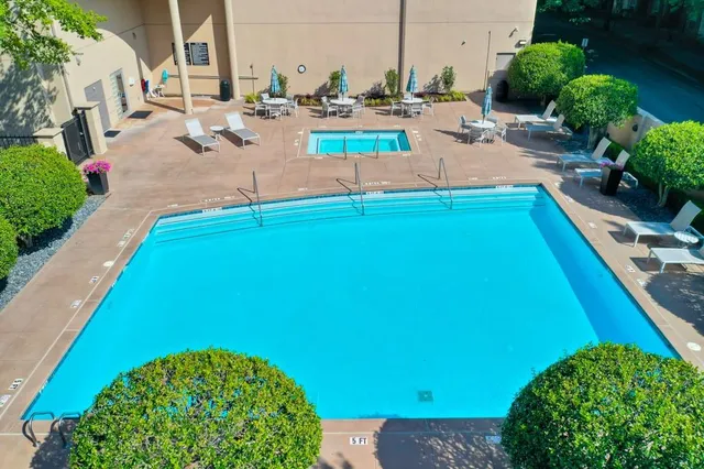 a view of a backyard with sitting area