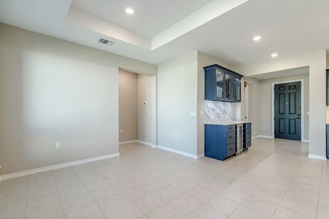 a view of an empty room with a fireplace
