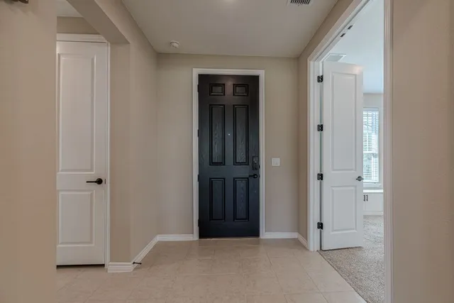 a view of workspace with windows and cabinet