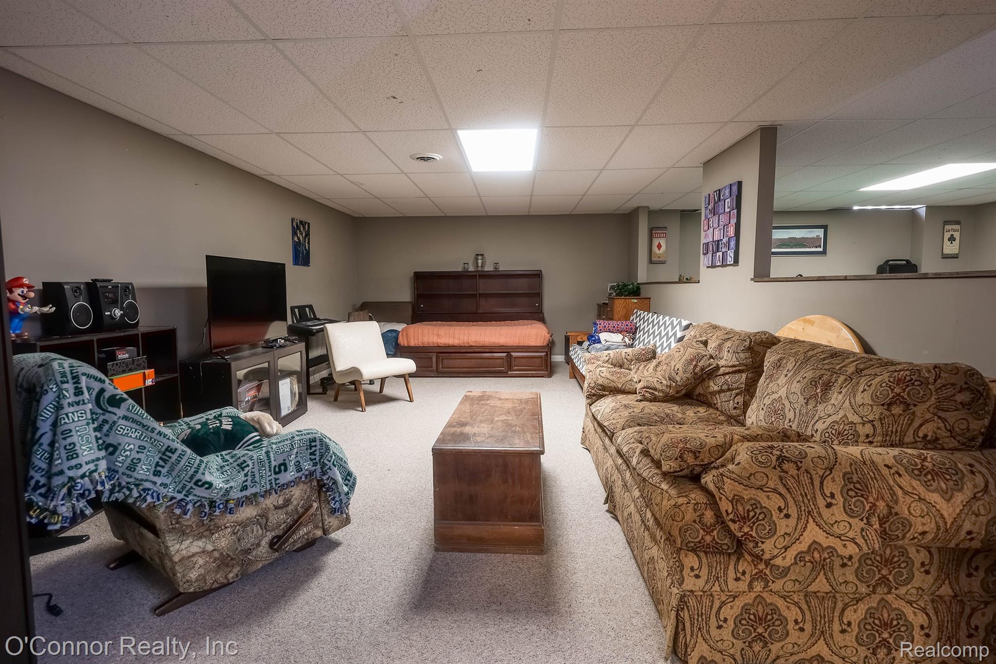 7978 Frith Road Columbus, MI 48063 - Photo 28 of 56 Carpeted living room featuring a drop ceiling