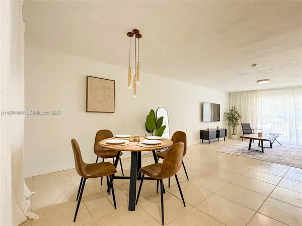 a view of a livingroom with furniture and lounge chair