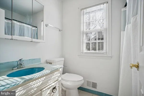 a bathroom with a sink and a toilet