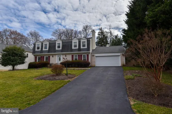 a view of house with yard and entertaining space